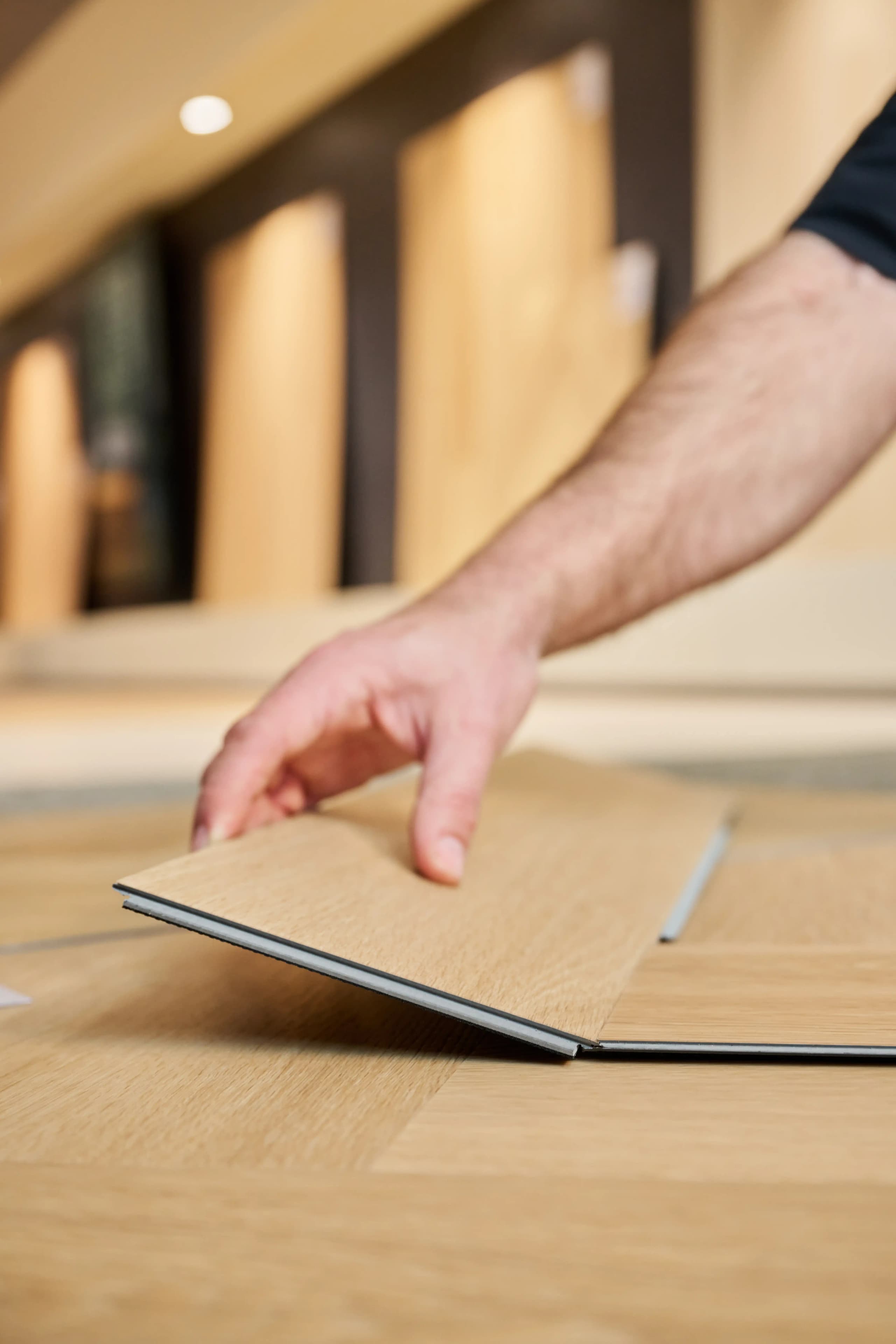 closeup-clicking-two-vinyl-herringbone-panels-together